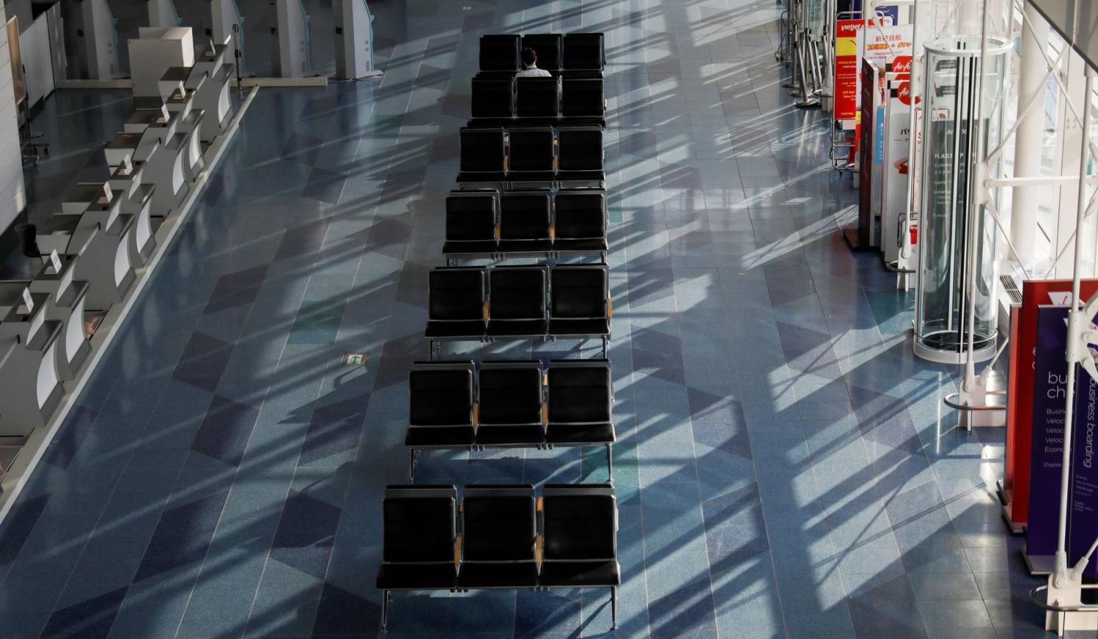 The internatio<em></em>nal departure terminal at Tokyo's Haneda Airport is almost empty in April. | REUTERS