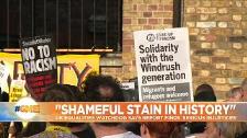 Sign reads <em></em>'Solidarity with the Windrush generation<em></em>' at a demostration in London