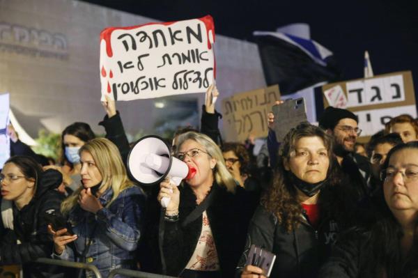 People stage a protest against the introduction of a new type of coro<em></em>navirus vaccine and the 