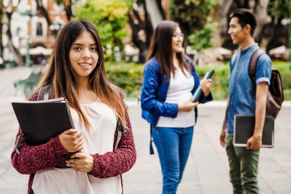 DACA student stands with friends