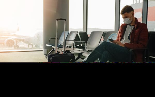 Traveler with covid mask at the airport